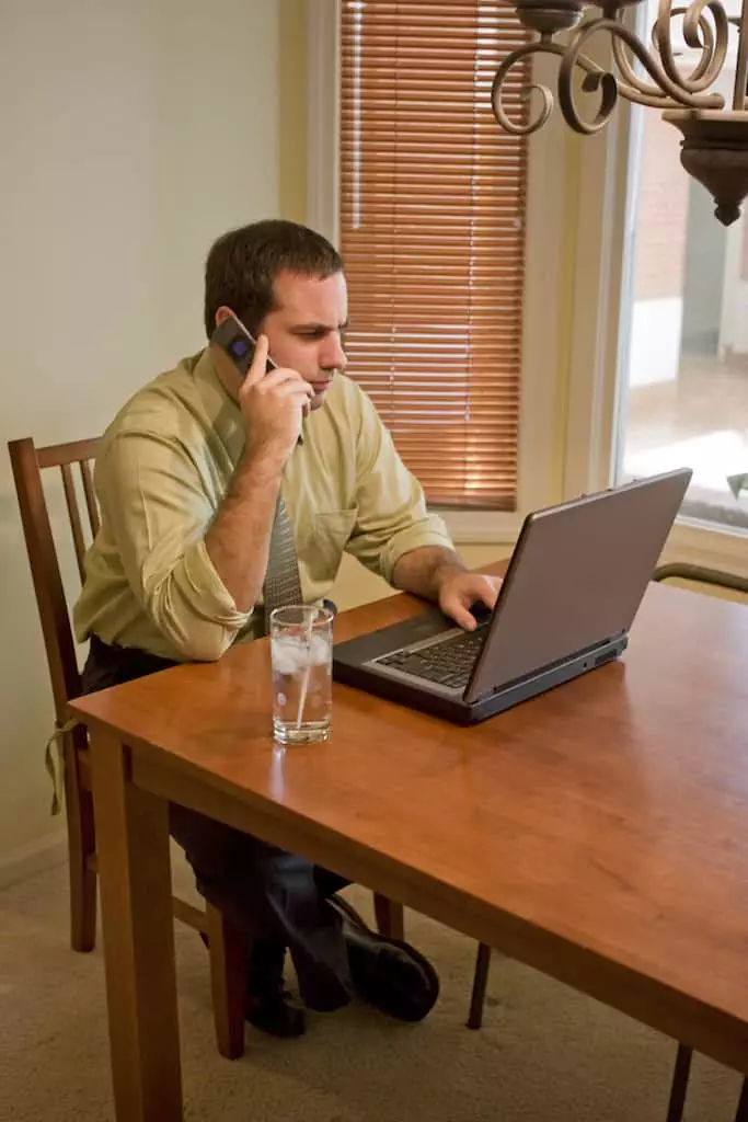 a-young-business-man-working-from-home-with-his-laptop_rtEmSPAHi